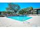 Outdoor swimming pool with surrounding lounge chairs, palm trees, and manicured landscaping at 9501 Shore Dr. # D-337, Myrtle Beach, SC 29572