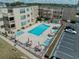 Aerial view of the property with a sparkling pool and outdoor lounge area at 9661 Shore Dr. # B-22, Myrtle Beach, SC 29572