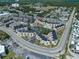 Aerial view of a condo complex, showing parking, the pool, and surrounding community at 9661 Shore Dr. # B-22, Myrtle Beach, SC 29572