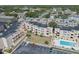 Aerial view of the condo complex featuring a pool, well-maintained landscaping, and ample parking at 9661 Shore Dr. # B-22, Myrtle Beach, SC 29572