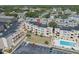 Aerial view of the condo complex featuring a pool, well-maintained landscaping, and ample parking at 9661 Shore Dr. # B-22, Myrtle Beach, SC 29572