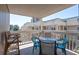 Relaxing balcony features a table set and views of the community at 9661 Shore Dr. # B-22, Myrtle Beach, SC 29572