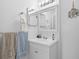 Bright and clean bathroom features a vanity with good lighting and decor at 9661 Shore Dr. # B-22, Myrtle Beach, SC 29572