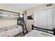 Bright bedroom featuring fun bunk beds with an open closet at 9661 Shore Dr. # B-22, Myrtle Beach, SC 29572