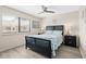 Comfortable bedroom with a nautical theme, a queen-sized bed, and ample natural light at 9661 Shore Dr. # B-22, Myrtle Beach, SC 29572
