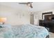 Bedroom features a ceiling fan, a TV on the dresser, and beach themed decorations at 9661 Shore Dr. # B-22, Myrtle Beach, SC 29572