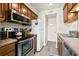 Well-lit kitchen offering plenty of countertop space and stainless steel appliances at 9661 Shore Dr. # B-22, Myrtle Beach, SC 29572