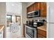 Updated kitchen appliances including stove, microwave, and breakfast bar at 9661 Shore Dr. # B-22, Myrtle Beach, SC 29572