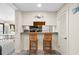 Efficient kitchenette design with wood cabinets and breakfast bar seating at 9661 Shore Dr. # B-22, Myrtle Beach, SC 29572