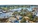 Aerial view of raised beach homes offering stunning views of the water, golf course, and marsh landscape at 9671 Stillwater Ct., Myrtle Beach, SC 29572