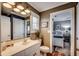Bathroom features a white vanity, and a view to an adjacent bedroom at 9671 Stillwater Ct., Myrtle Beach, SC 29572
