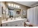 Well-lit bathroom features a white vanity, framed seahorse art, and decorative turtle accent at 9671 Stillwater Ct., Myrtle Beach, SC 29572