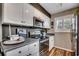 Bright kitchen featuring stainless steel appliances, white cabinets, modern fixtures, and plenty of counter space at 9671 Stillwater Ct., Myrtle Beach, SC 29572