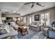 Inviting living room featuring hardwood floors, vaulted ceilings and neutral tones with comfortable furnishings and ceiling fans at 9671 Stillwater Ct., Myrtle Beach, SC 29572