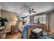 Comfortable main bedroom featuring hardwood floors, natural light, ceiling fan and dresser at 9671 Stillwater Ct., Myrtle Beach, SC 29572