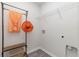 Laundry room with shelving, hanging rod, and gray vinyl flooring at 1004 Garden Sprout Dr, Galivants Ferry, SC 29544