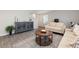 Cozy living room featuring neutral tones, stylish furniture, and a rustic coffee table at 1004 Garden Sprout Dr, Galivants Ferry, SC 29544