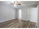 Cozy primary bedroom offers wood flooring, neutral walls, and a closet at 103 Station St., Longs, SC 29568