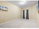 Bedroom with a carpeted floor, neutral walls, one window with curtains, and artwork on the walls at 1033 World Tour Blvd. # 101-A, Myrtle Beach, SC 29579