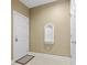 Neutral-toned hallway with white door, trim, and tiled floors at 1033 World Tour Blvd. # 101-A, Myrtle Beach, SC 29579