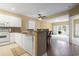 Bright, open kitchen with white appliances, granite countertops, and an open living area at 1033 World Tour Blvd. # 101-A, Myrtle Beach, SC 29579