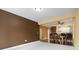 Spacious living room with carpeted floors and view to dining and kitchen area at 1033 World Tour Blvd. # 101-A, Myrtle Beach, SC 29579