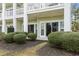 Ground floor patio of condo with sliding glass doors and manicured landscaping at 1033 World Tour Blvd. # 101-A, Myrtle Beach, SC 29579