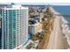 Aerial view of a beachfront condo with beach access and a large pool area at 107 Ocean Blvd. S # 1707, Myrtle Beach, SC 29577