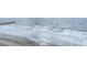 Calm waves rolling into the sandy beach at 107 Ocean Blvd. S # 1707, Myrtle Beach, SC 29577