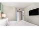 Bedroom with queen bed, ensuite access, and flat-screen TV at 107 Ocean Blvd. S # 1707, Myrtle Beach, SC 29577