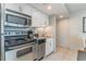 Efficient kitchen features stainless steel appliances and granite countertops at 107 Ocean Blvd. S # 1707, Myrtle Beach, SC 29577