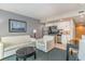 Cozy living room with kitchen, stainless appliances and white furnishings at 107 Ocean Blvd. S # 1707, Myrtle Beach, SC 29577