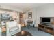 Inviting living room with compact kitchen, table, and white furniture at 107 Ocean Blvd. S # 1707, Myrtle Beach, SC 29577
