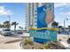 Oceans One Resort signage in front of a modern high-rise building near parking at 107 Ocean Blvd. S # 1707, Myrtle Beach, SC 29577