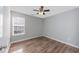 Bedroom features a ceiling fan, window, and wood-look floors at 1108 Patricia Ct., Conway, SC 29526