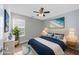 Comfortable bedroom with a ceiling fan, a plush bed, and lots of natural light, creating a serene retreat at 1108 Patricia Ct., Conway, SC 29526