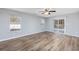 Spacious bedroom featuring hardwood floors, bright windows, and a sliding glass door to a backyard patio at 1108 Patricia Ct., Conway, SC 29526