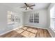 Bright bedroom featuring wood-look floors and multiple windows for natural light at 1108 Patricia Ct., Conway, SC 29526