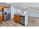 Kitchen with stainless steel appliances, wooden cabinets and breakfast bar seating at 1108 Patricia Ct., Conway, SC 29526