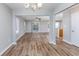 Open concept living room with wood-look floors, chandelier and view into kitchen at 1108 Patricia Ct., Conway, SC 29526