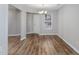 Bright living room features wood-look floors and a chandelier light fixture at 1108 Patricia Ct., Conway, SC 29526