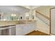 Kitchen area with bar overlooking the living room and stairs at 12 Courtyard Circle # 36, Pawleys Island, SC 29585