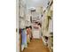 Organized walk-in closet featuring shelving, hanging racks, and wooden floors at 12 Courtyard Circle # 36, Pawleys Island, SC 29585