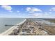 Stunning aerial view of homes along the beach offering easy access to both the ocean and marsh at 132 Garden City Retreat Dr., Murrells Inlet, SC 29576
