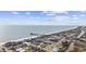 Beautiful aerial view of homes along the beach with ocean views and a fishing pier in the background at 132 Garden City Retreat Dr., Murrells Inlet, SC 29576