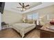 Bedroom with a fan, tray ceiling, and coordinated decor offers a relaxing space at 132 Garden City Retreat Dr., Murrells Inlet, SC 29576