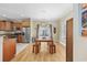 Comfortable dining area adjacent to kitchen includes wood floors, table and access to rear balcony at 132 Garden City Retreat Dr., Murrells Inlet, SC 29576