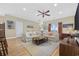 Bright living room featuring hardwood floors, plush sofas, and a breakfast bar at 132 Garden City Retreat Dr., Murrells Inlet, SC 29576
