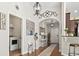 Open entryway with hardwood floors, arched doorway, and decorative accents leading to other rooms at 1412 Rainsbrook Ct., Conway, SC 29526