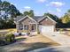 Charming home with a well-maintained lawn, landscaped flower beds, and a private driveway at 1412 Rainsbrook Ct., Conway, SC 29526